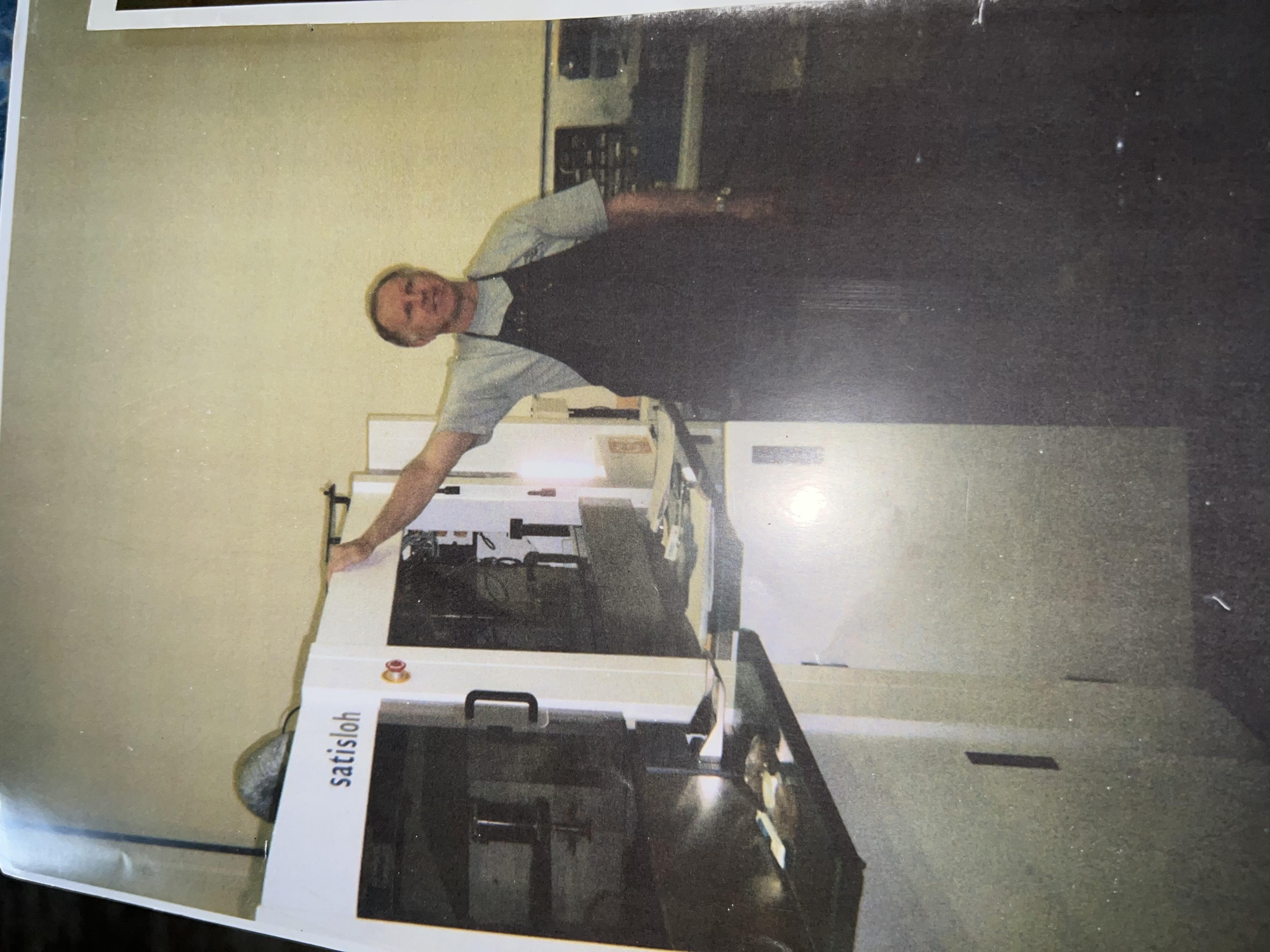 Michael with the Satisloh optical lens coating machine at SMG, Huntington Beach